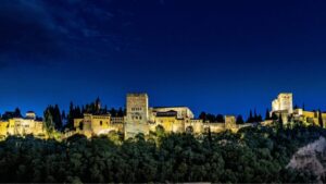 Alhambra: Nasrid Palaces Guided Night Tour without tickets - Palacio de Carlos V after dark: Renaissance geometry meets moonlit shadow