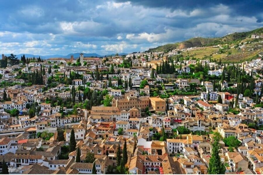 Granada: Albayzin and Sacromonte Walking Tour - Plaza Nueva start: the 11th-century story that makes the neighborhoods make sense