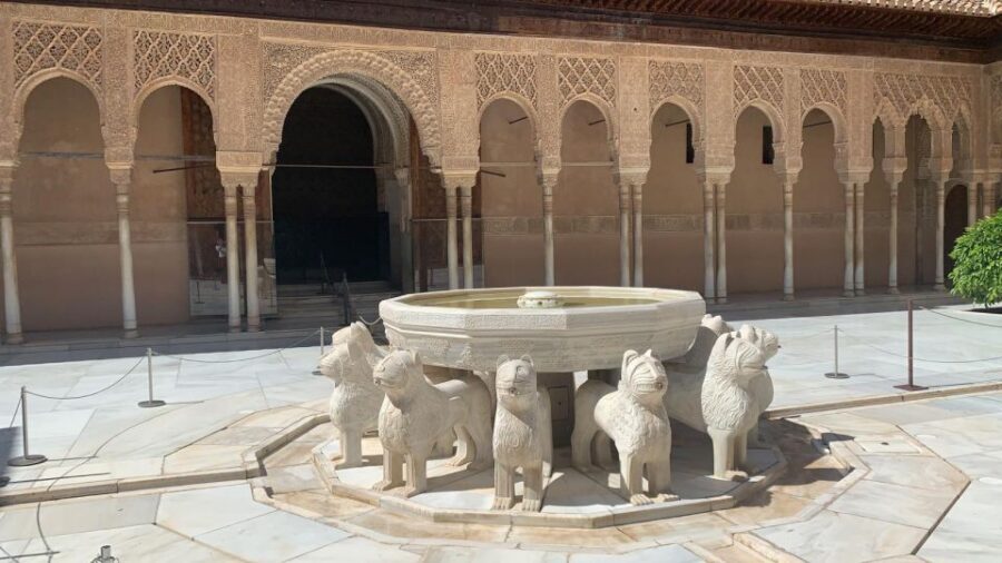Granada: Alhambra Guided Tour w/ Nasrid Palaces & City Pass - Transport included: 9 bus rides and 1 tourist-train ticket
