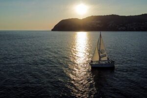 Sunset sailing along the cliffs of Maro- Private - The welcome toast and onboard comfort (aka: why you’ll feel relaxed)